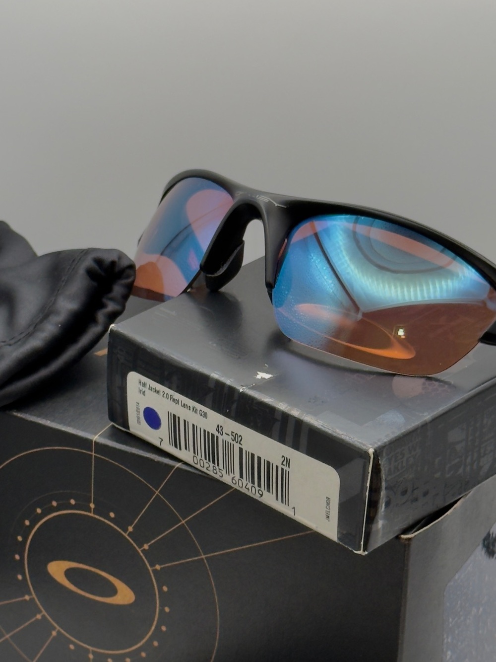Oakley Black Frame Sunglasses with Blue-Orange Iridium Lenses